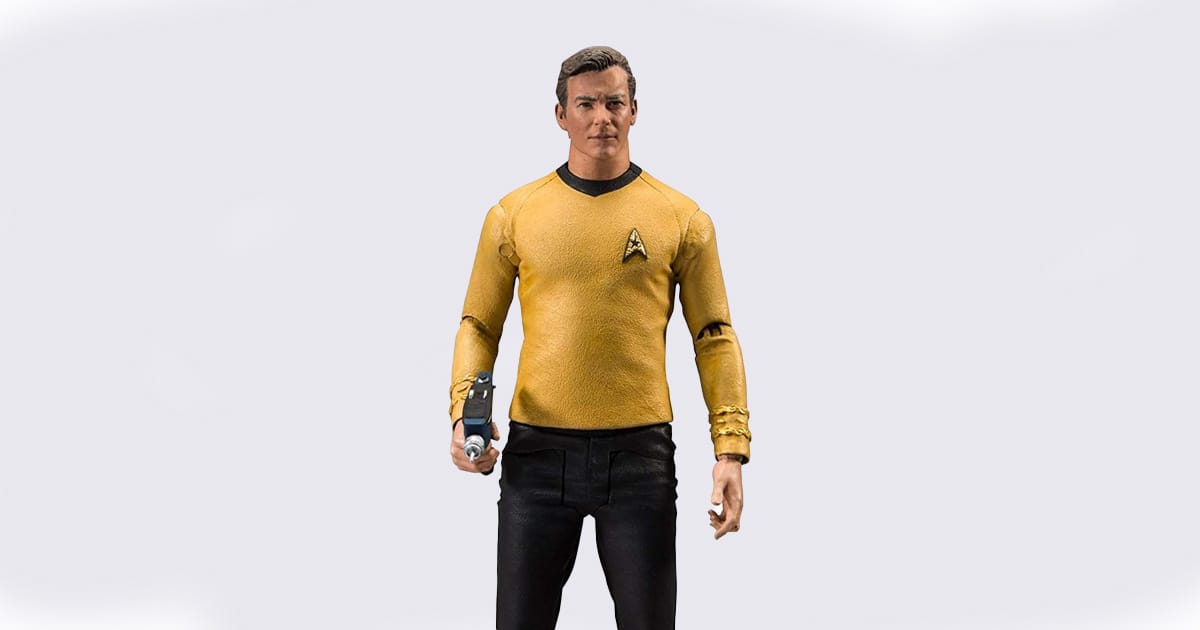 Detailed action figure of Captain James T. Kirk wearing a gold Starfleet uniform and holding a phaser, modeled after his classic appearance in Star Trek.
