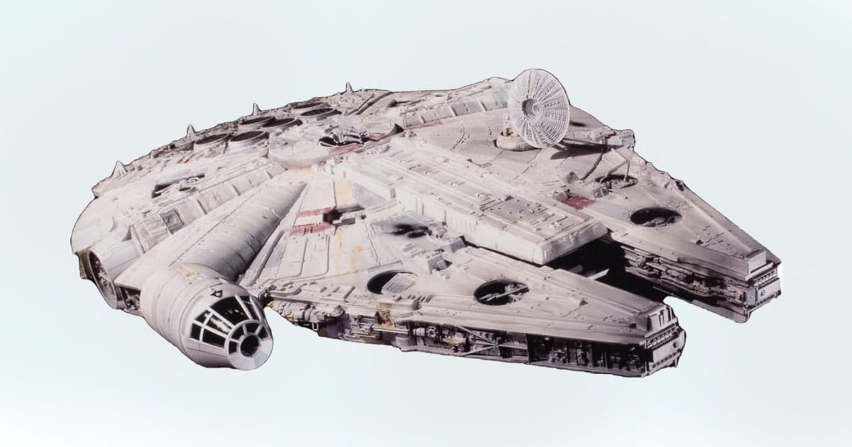 Model of the Star Wars Millennium Falcon showing detailed panels, cockpit, and radar dish.