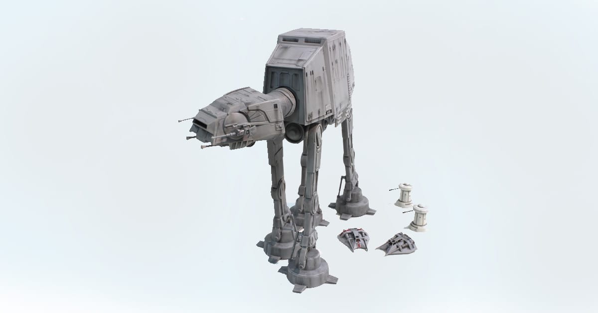 Model of Star Wars AT-AT walker with Snowspeeders and laser turrets included for a Hoth diorama.