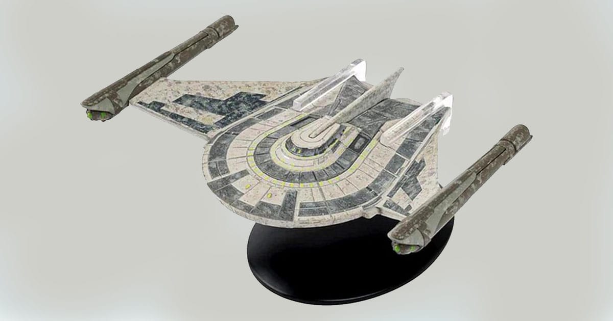 Romulan Bird-of-Prey starship replica on display stand with curved wing design and nacelles.
