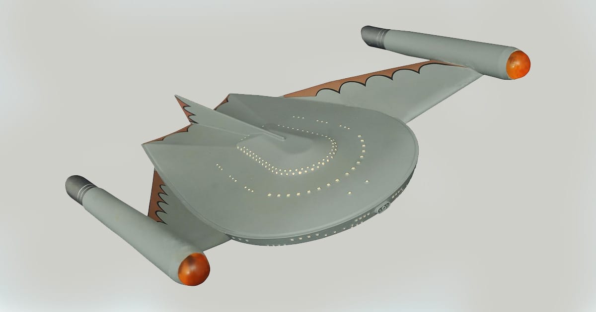 Romulan Bird-of-Prey replica with gray hull, orange nacelle tips, and wing pattern from the Original Series.