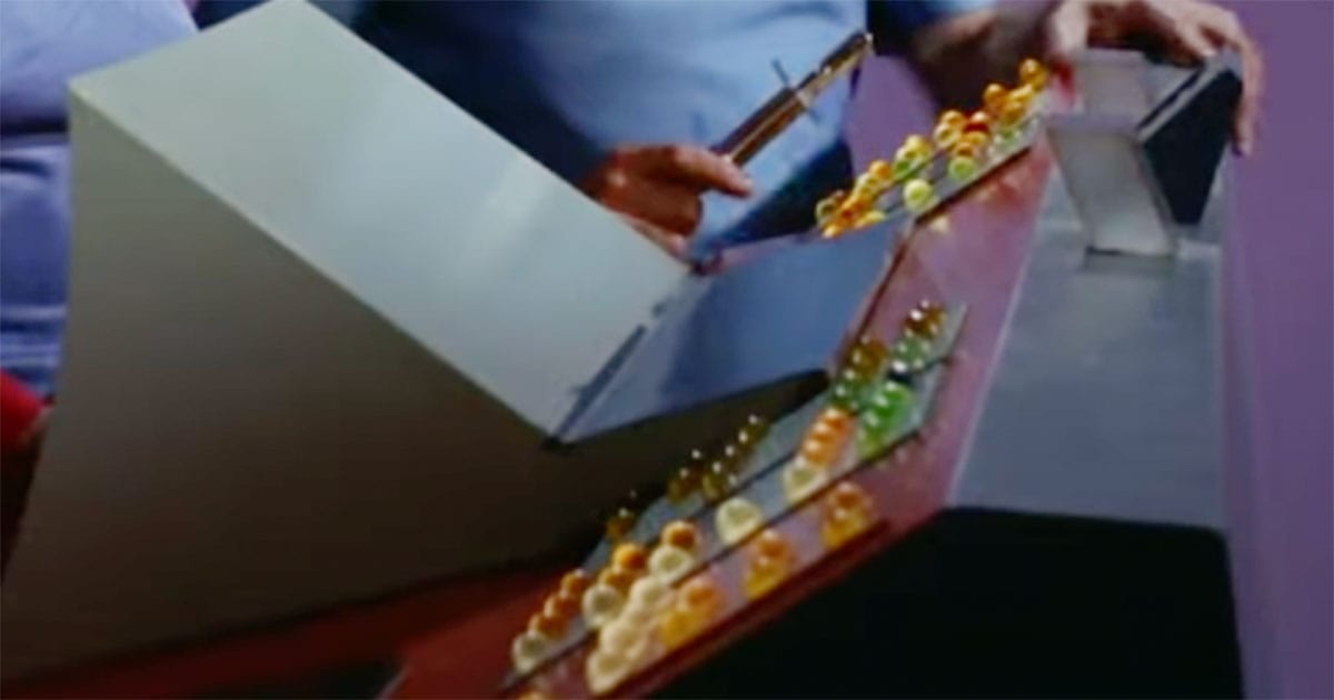 Original "Star Trek" Enterprise transporter console with rows of colorful jelly bean buttons and operator controls.