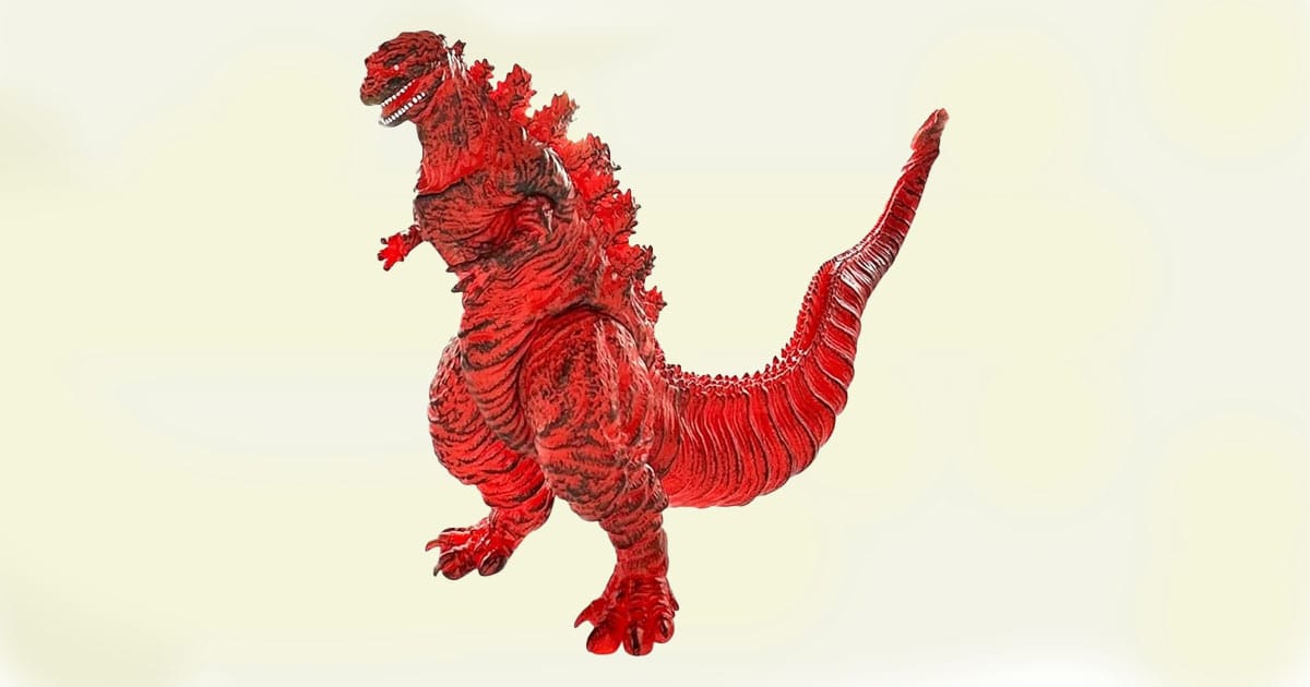 Fire Shin Godzilla action figure in vivid red with black detailing, posed upright with extended tail and jagged dorsal fins.