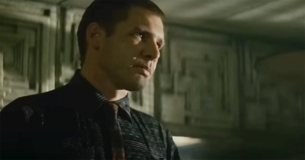 Rick Deckard staring solemnly in his apartment in "Blade Runner."