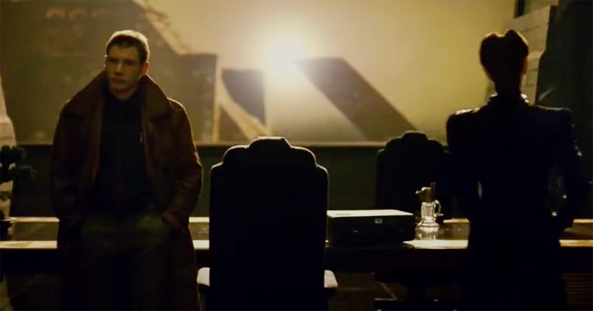 Deckard and Rachael in Tyrell’s office silhouetted against the glowing skyline, evoking uncertainty and introspection.