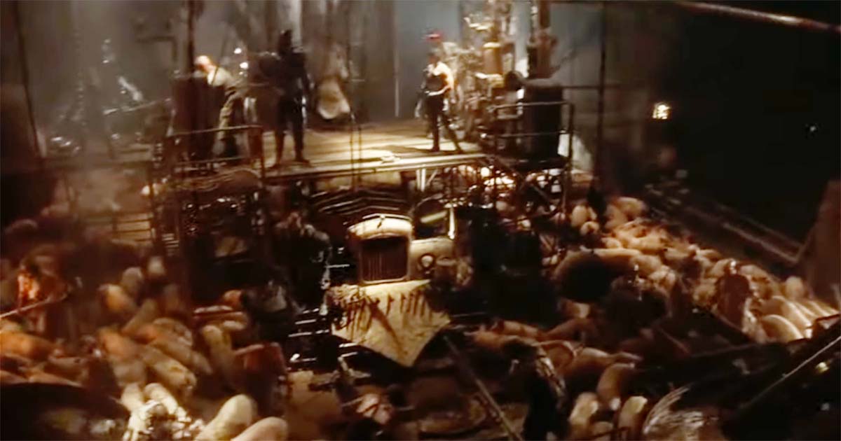 Underground methane refinery in Mad Max Beyond Thunderdome where pigs fuel Bartertown’s crude power system beneath a platform of workers and machinery
