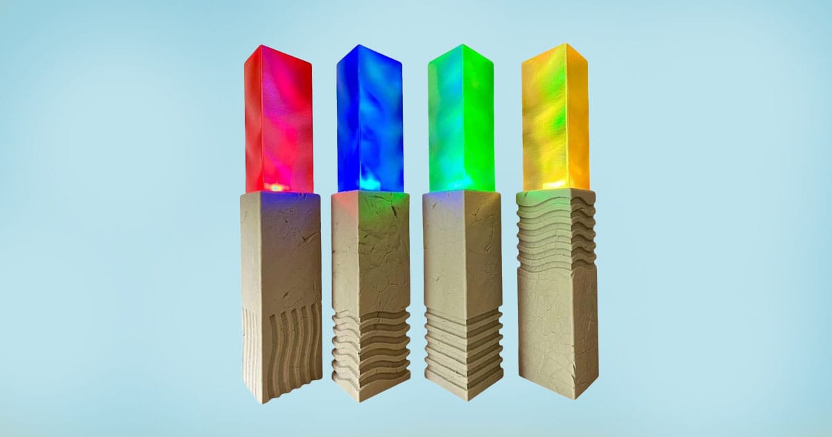 Set of four LED-lit elemental stone replicas from The Fifth Element glowing in red blue green and yellow.