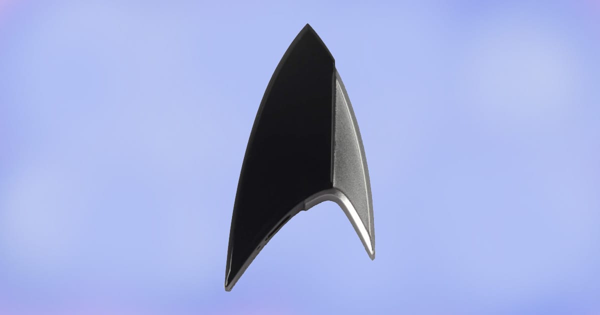 Star Trek Section 31 Bluetooth ComBadge replica with sleek black and silver delta design.