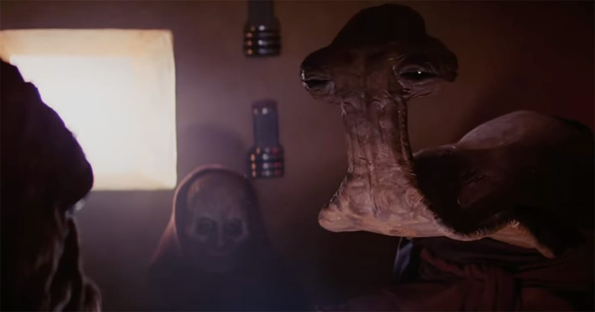 Close-up of the Hammerhead alien from the "Star Wars" cantina scene, featuring its tall, T-shaped head and contemplative expression.