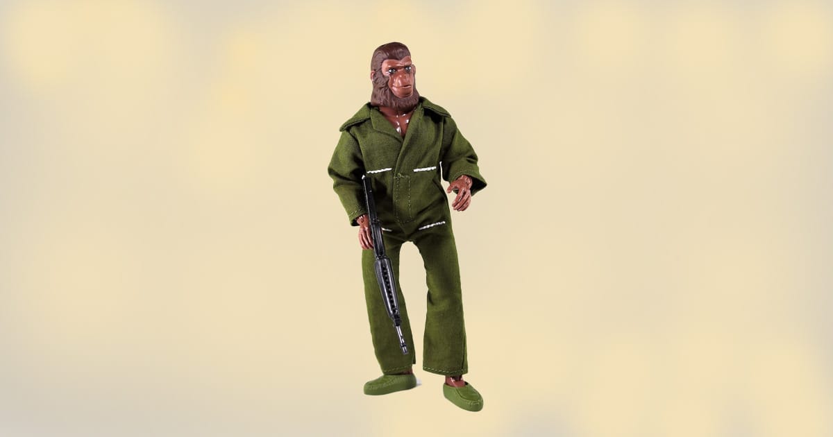 8-inch Caesar action figure from Planet of the Apes wearing green fabric outfit and holding a rifle