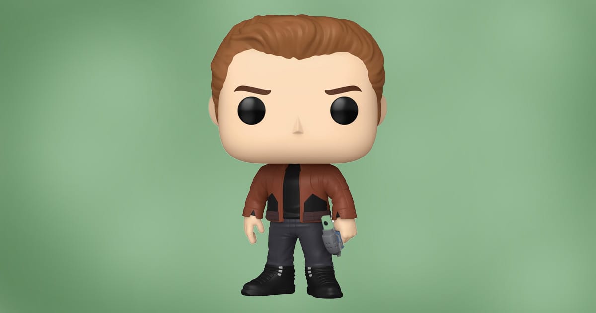 Funko Pop figure of Jack Crusher from Star Trek: The Next Generation wearing a brown jacket and holding a blaster, against green background.