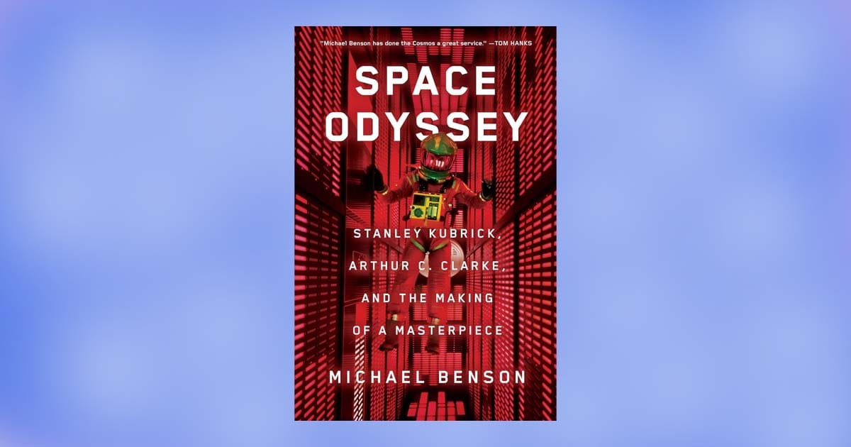 Cover of Space Odyssey by Michael Benson showing a suited astronaut inside a red-lit futuristic corridor.