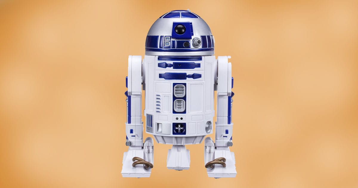 Remote control R2-D2 action figure with blue and white detailing shown upright against a neutral background.