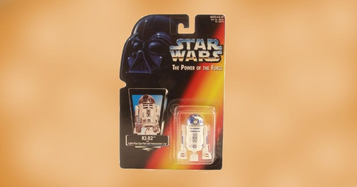 Carded Star Wars Power of the Force R2-D2 action figure featuring light-pipe eye and retractable leg in original packaging.