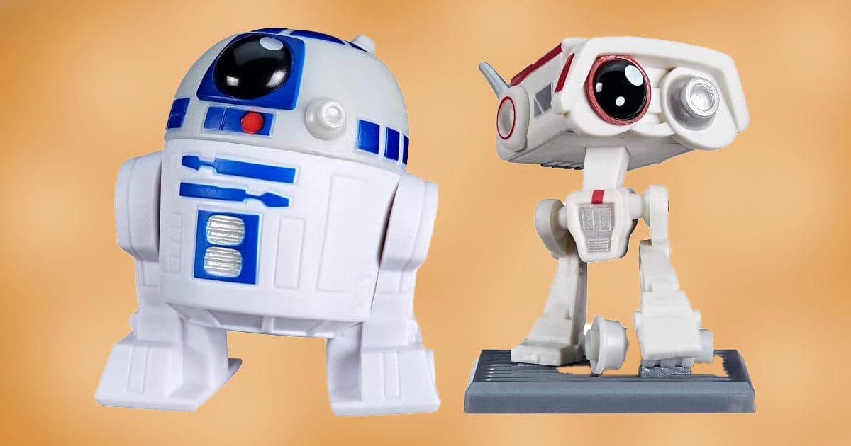 Stylized vinyl figures of R2-D2 and BD-1 from the Star Wars Bounty Collection displayed against a neutral background.