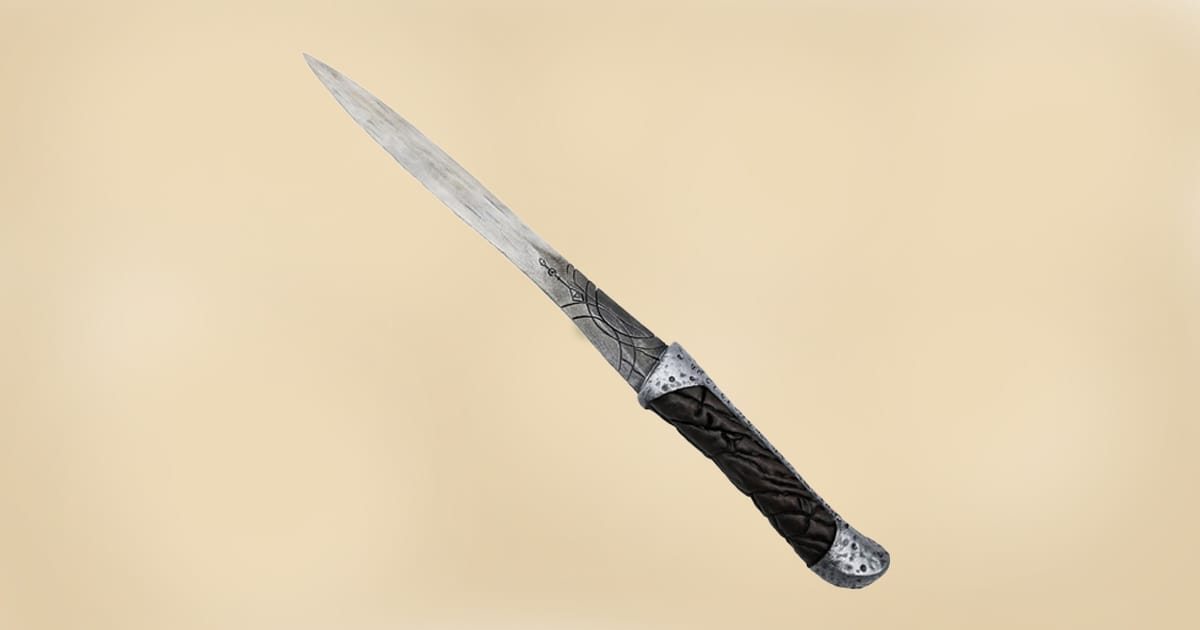 Replica of a Dune crysknife with detailed handle and weathered blade design.