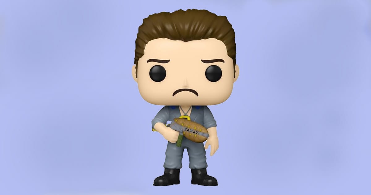 Funko Pop figure of Guy Fleegman from Galaxy Quest with sad expression and gray jumpsuit