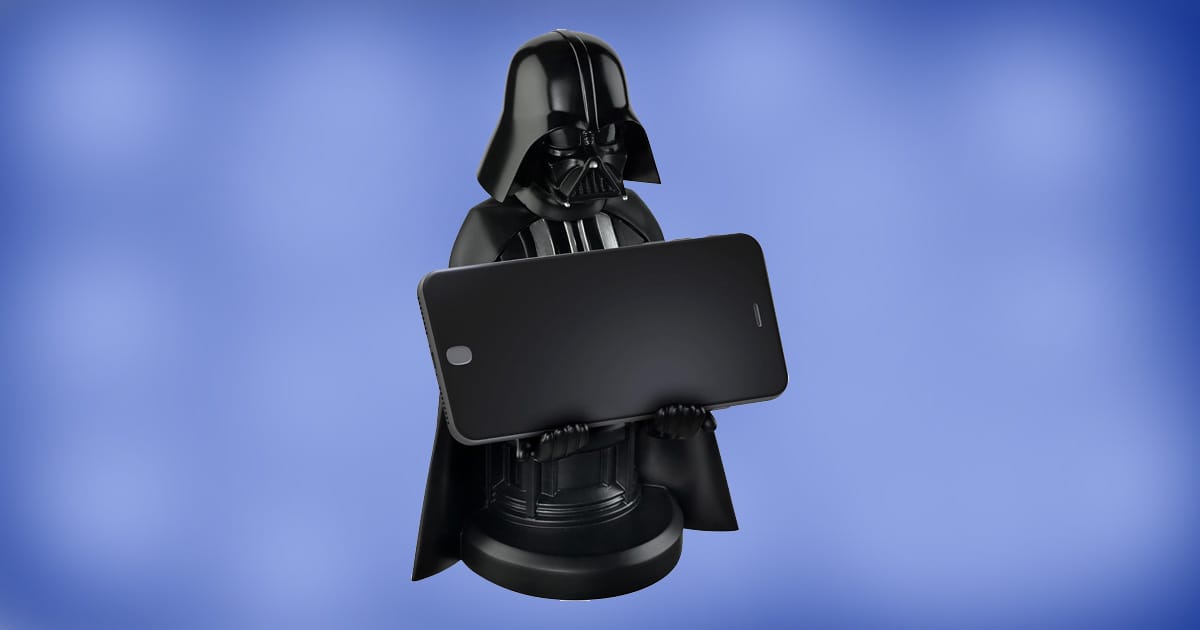 Darth Vader mobile phone and controller stand holding a smartphone on a blue background.