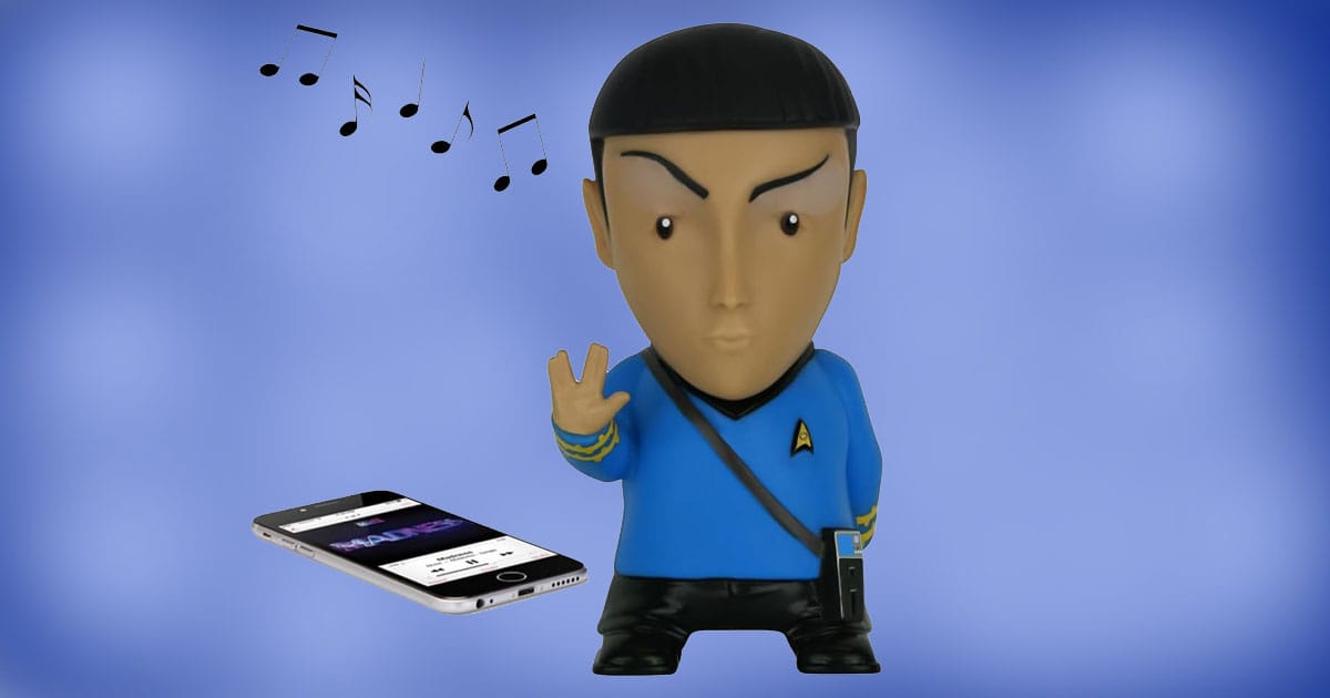 Mr. Spock 6-inch talking Bluetooth speaker figure with tricorder, playing music from a smartphone, on a blue background.