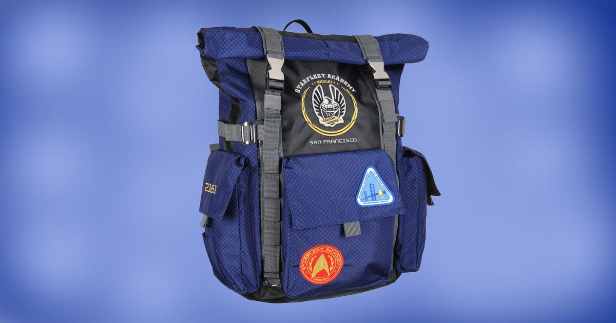 Star Trek Starfleet Academy Roll Top Backpack with embroidered patches and roll-top design on blue background.