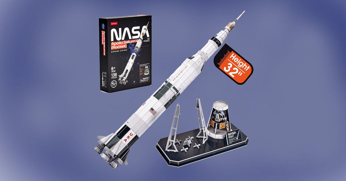 NASA Apollo Saturn V 3D puzzle model kit with 32-inch rocket, lunar lander, and display stand shown alongside packaging.