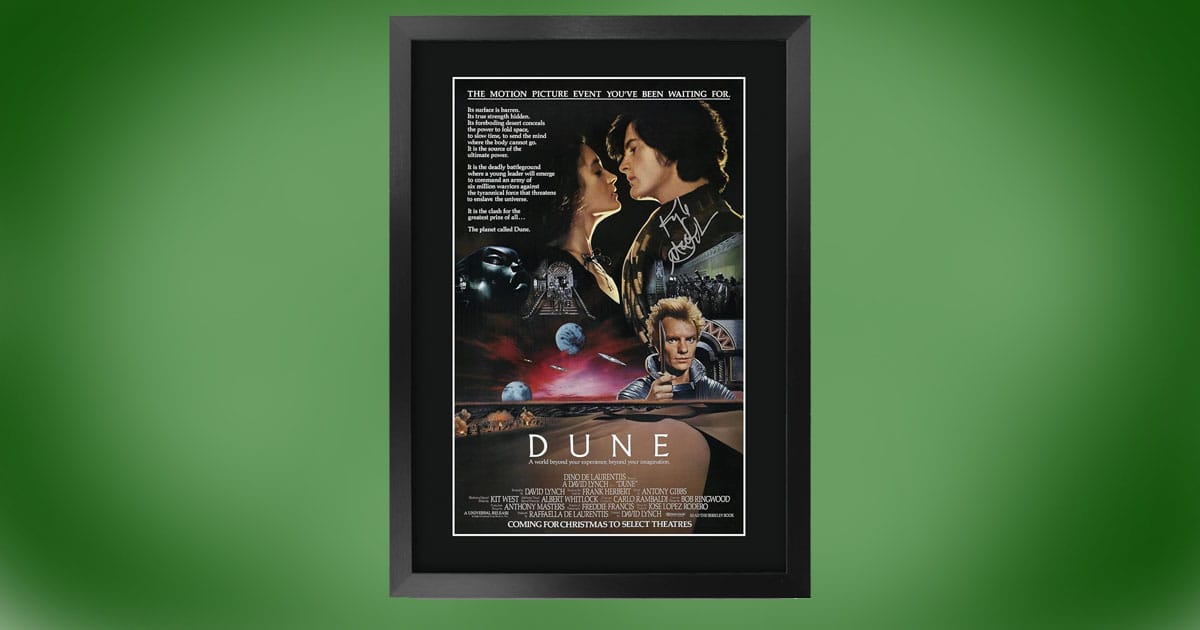 Framed Dune movie poster with authentic autograph in black frame.