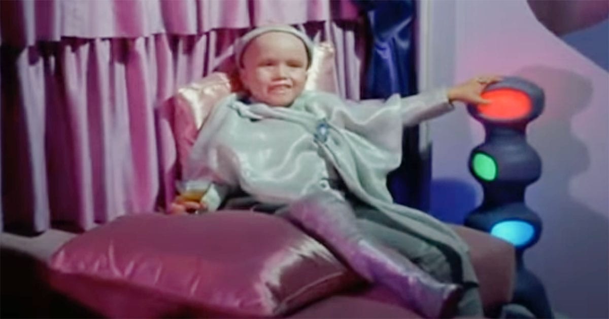 Balok, childlike alien commander in silver robe, sitting in his ship from "Star Trek: The Original Series" episode "The Corbomite Maneuver."