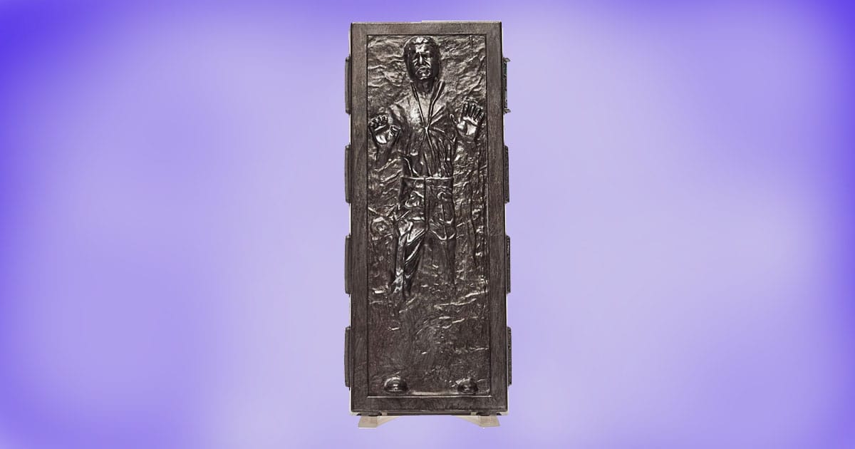 Han Solo in carbonite collectible figure standing upright on purple background.