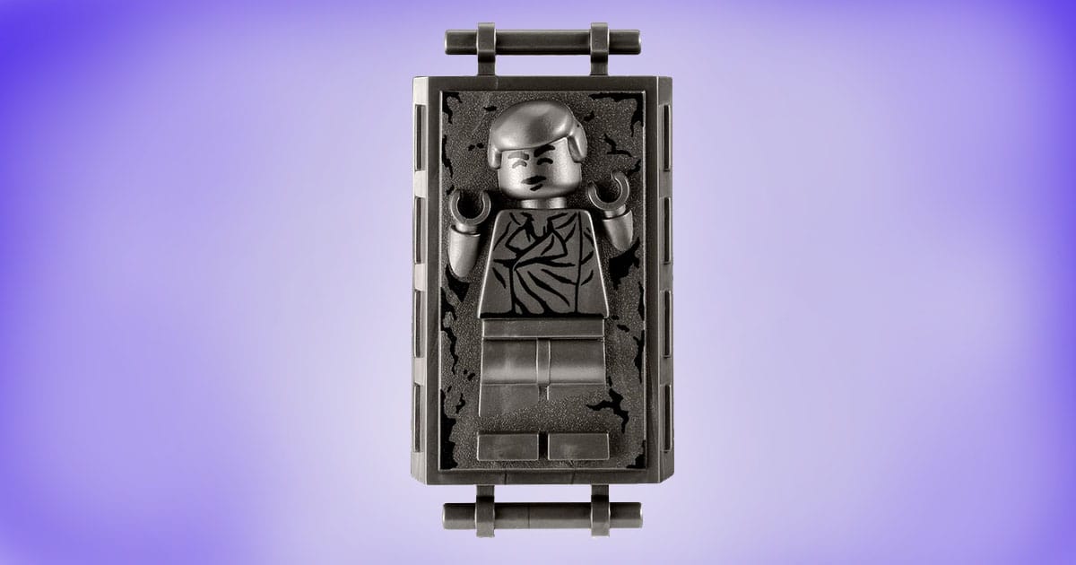 LEGO Han Solo in carbonite brick on purple background.