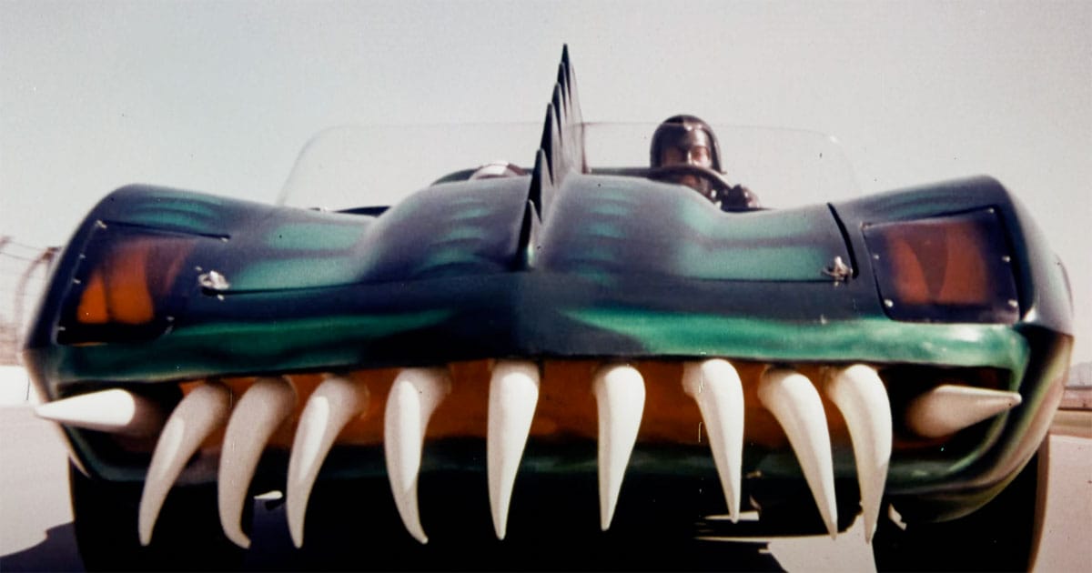 A screen capture showing a race car with teeth.