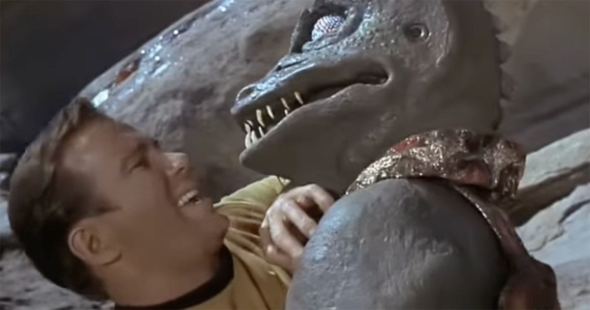 Captain Kirk confronts the Gorn in Star Trek episode Arena, showing mercy after defeating his alien opponent.