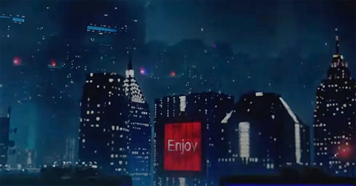 Los Angeles skyline in Blade Runner featuring dark skyscrapers, glowing windows, and a large illuminated advertisement at night.