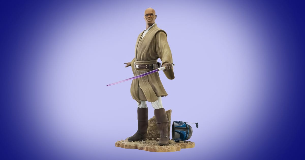Mace Windu statue holding purple lightsaber with Jango Fett helmet at his feet from Star Wars Attack of the Clones.
