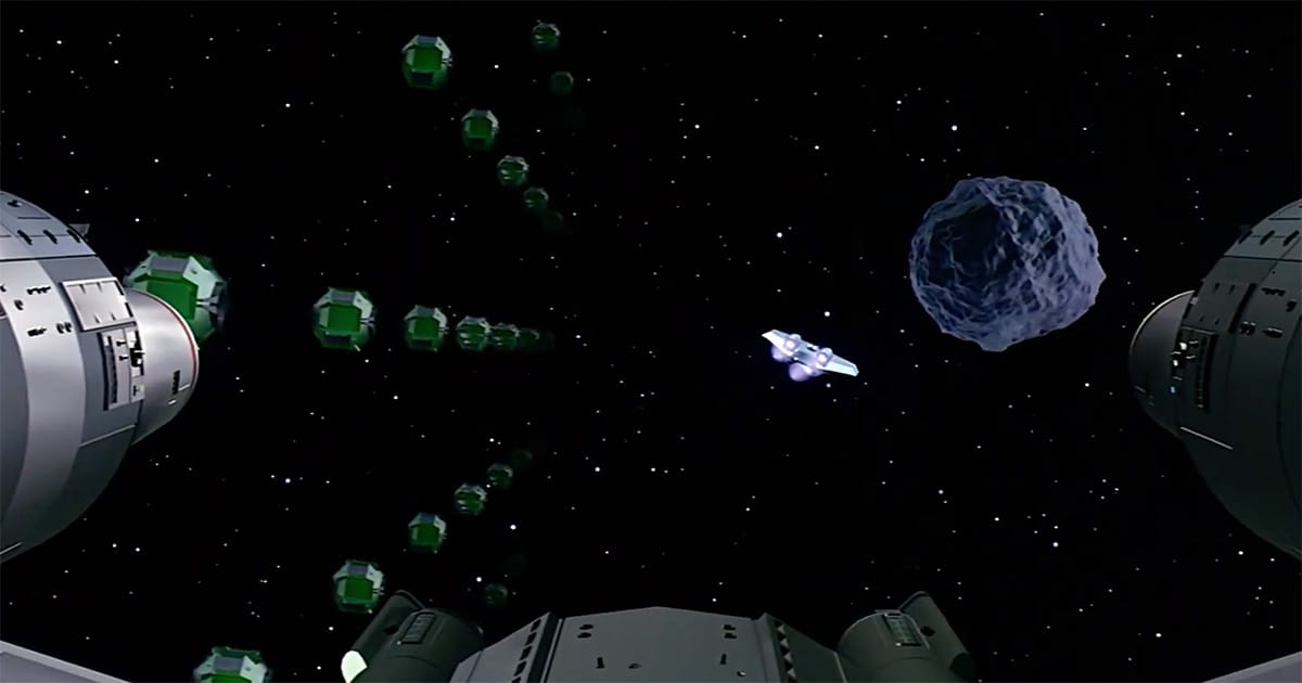 Wide CGI space scene from The Last Starfighter with asteroids and enemy ships rendered by computer.