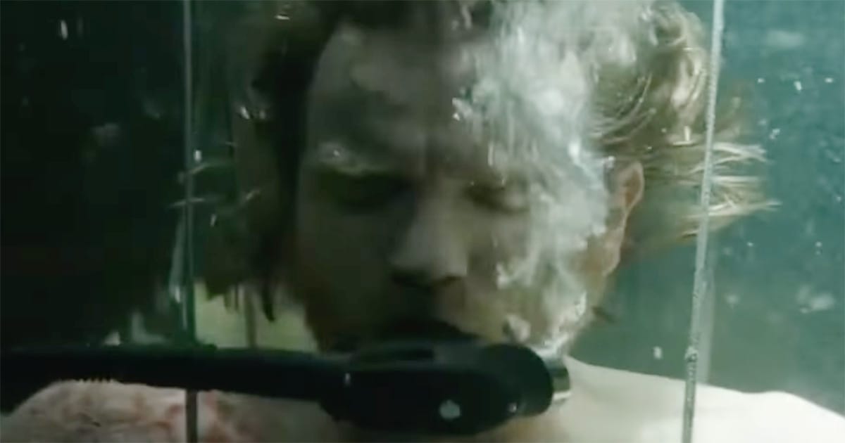 Close-up of Luke Skywalker submerged in bacta tank with breathing apparatus in “The Empire Strikes Back”