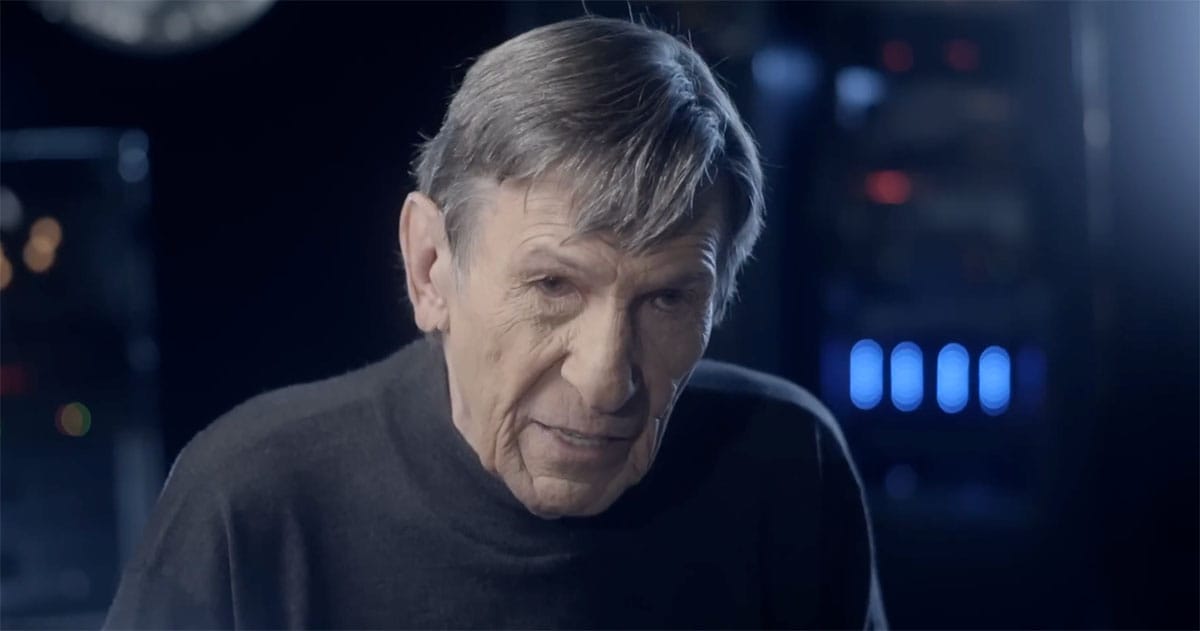 Leonard Nimoy in later career appearance wearing dark clothing in a reflective science fiction scene.