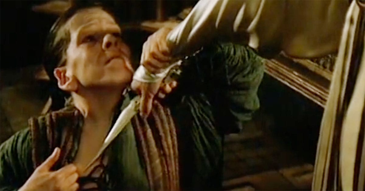 Shadout Mapes holding a crysknife to Lady Jessica’s throat during the ritual test in the 1984 film Dune.
