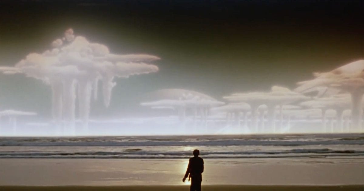Final scene of The Quiet Earth showing Zac on alien shoreline under strange sky.