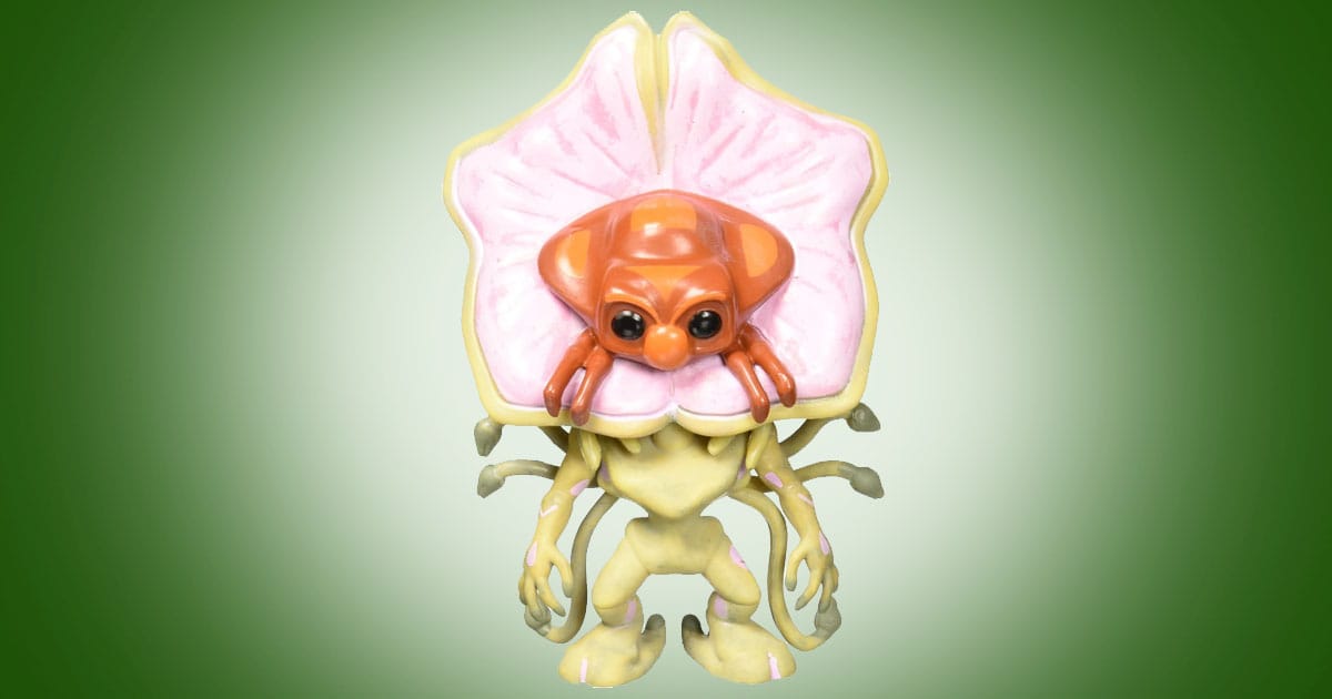 Funko Independence Day alien Chase Edition vinyl figure with biomechanical suit and exposed alien form against green background.