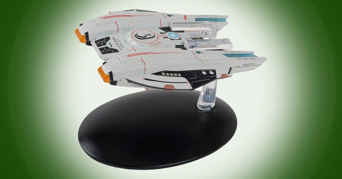 Model of Shran-Class Federation Light Pilot Escort from Star Trek Online with compact hull and twin nacelles mounted on a display stand.