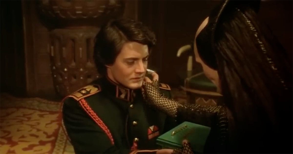 Bene Gesserit woman examining young Paul Atreides in a formal interior, reflecting the secret breeding program behind the Kwisatz Haderach.