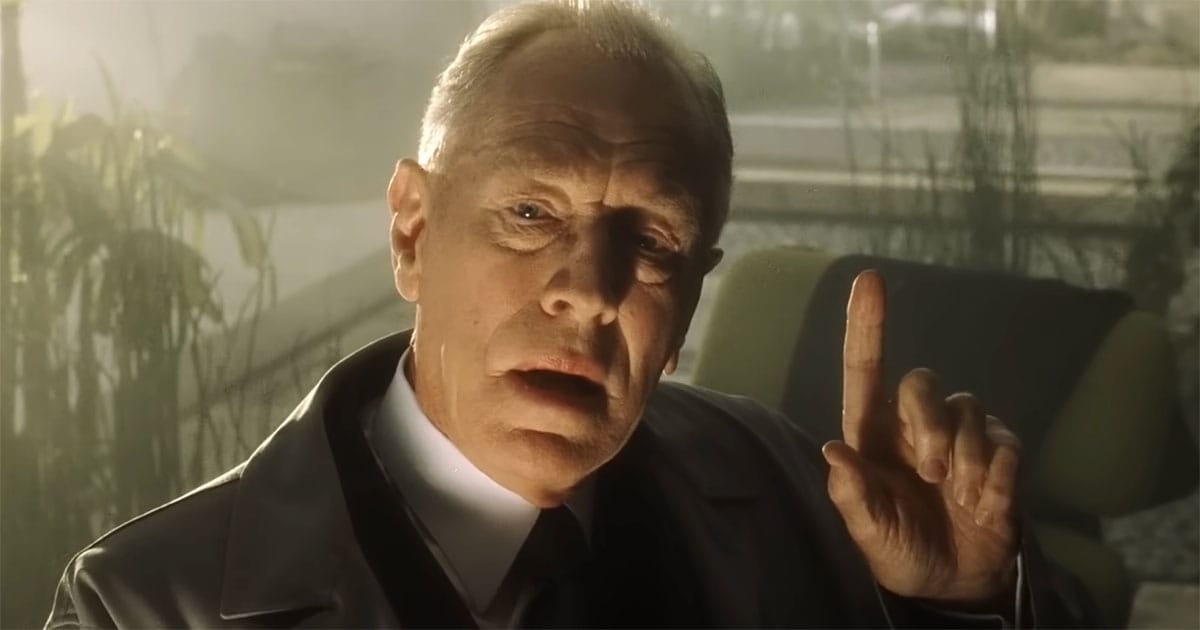 Max von Sydow as Lamar Burgess speaking with raised finger in Minority Report.