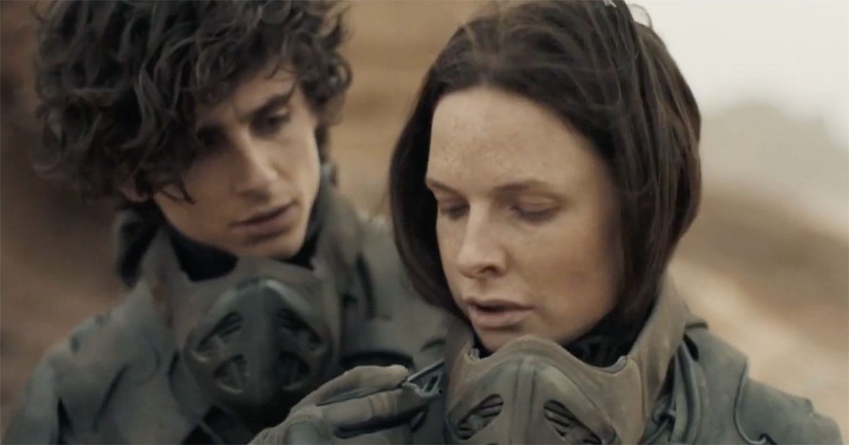 Paul Atreides and Lady Jessica in stillsuits in the desert, showing their early struggle and the turning point in his journey in Dune.