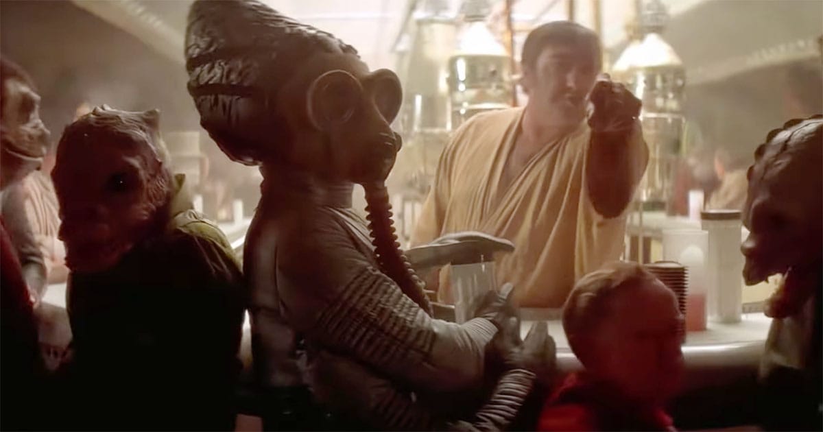 Mos Eisley cantina bar scene with multiple alien patrons and bartender engaged in everyday social interaction within a crowded spaceport setting.
