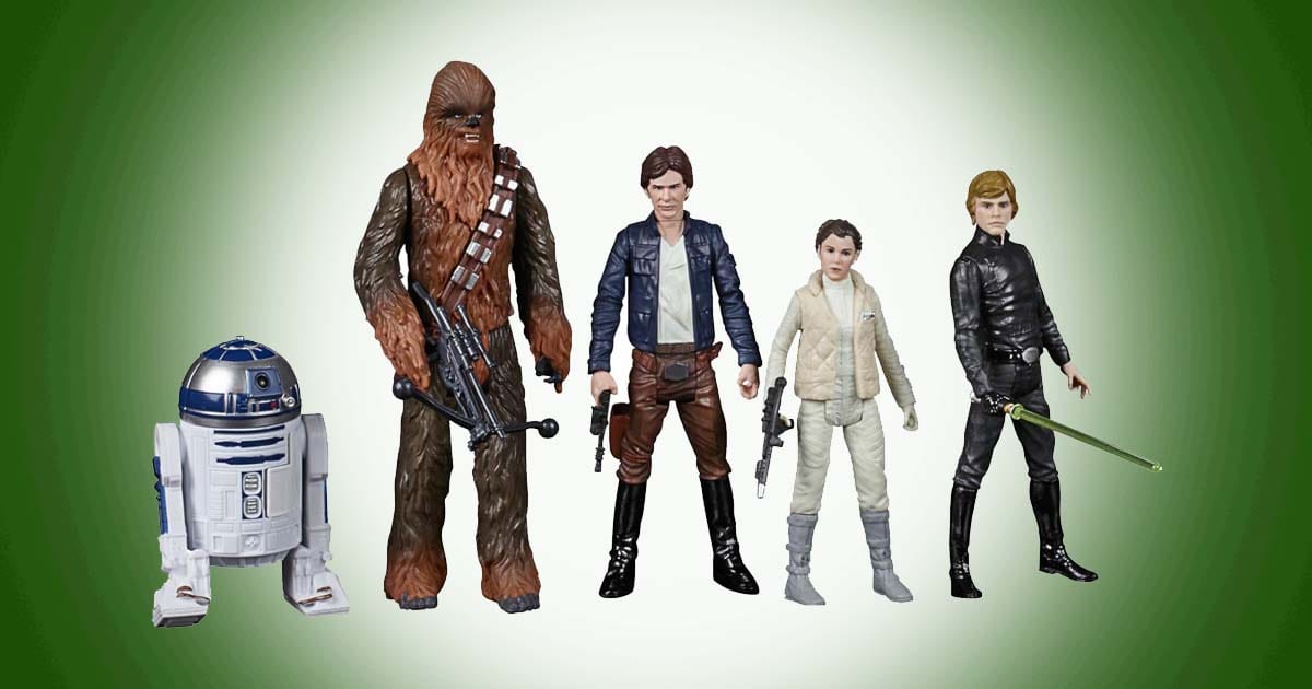 Star Wars action figures featuring R2-D2, Chewbacca, Han Solo, Princess Leia, and Luke Skywalker displayed together.