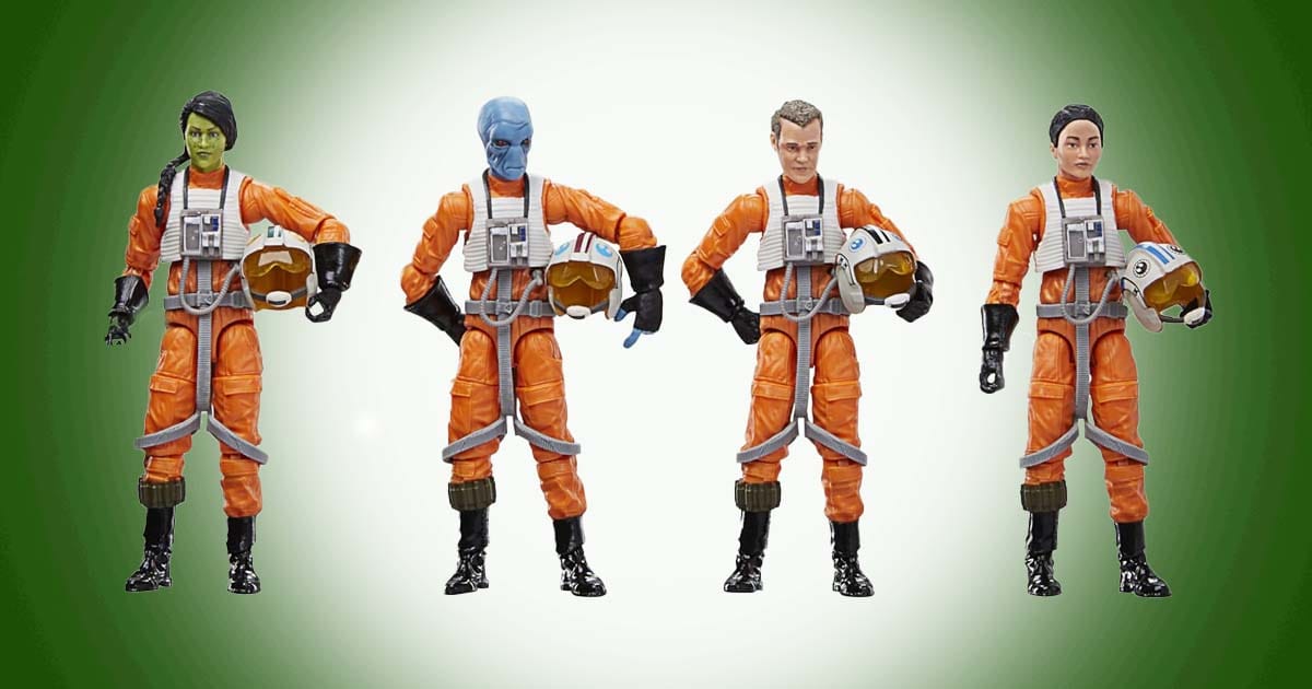 Star Wars X-wing pilot action figures in orange flight suits holding helmets displayed in a row.