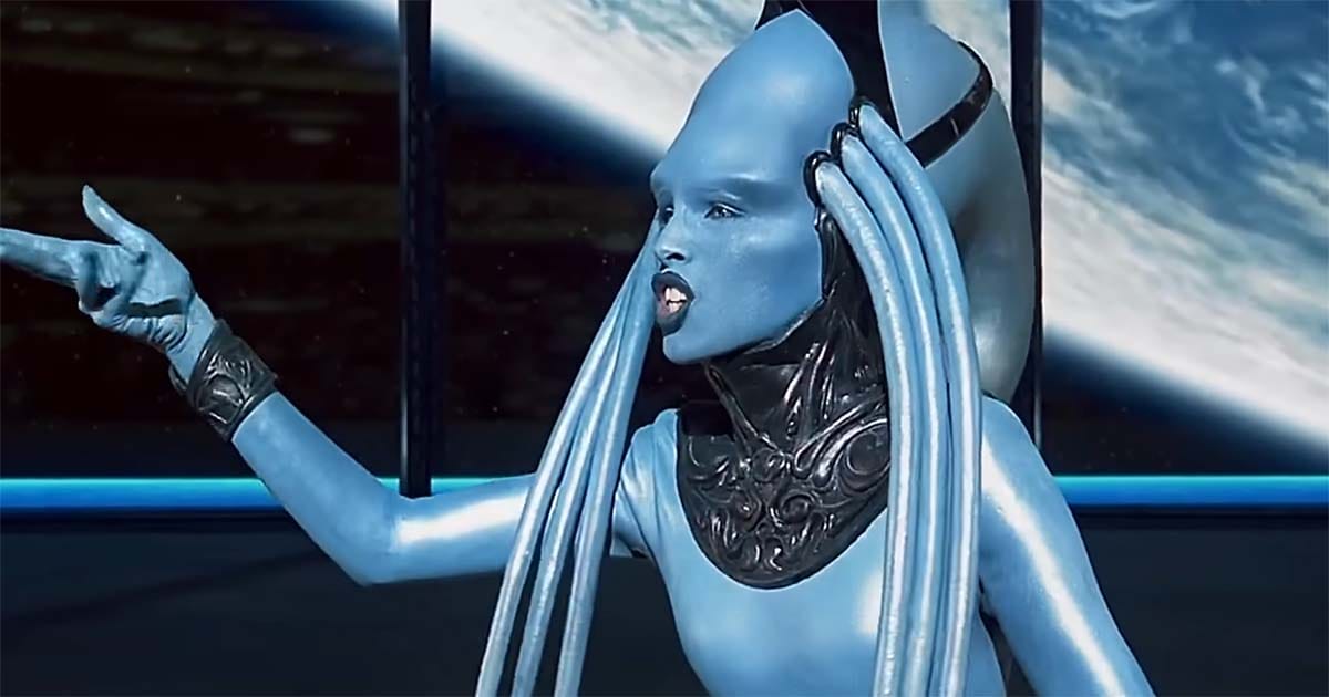 Blue alien opera singer performing dramatic scene in futuristic space setting in The Fifth Element.