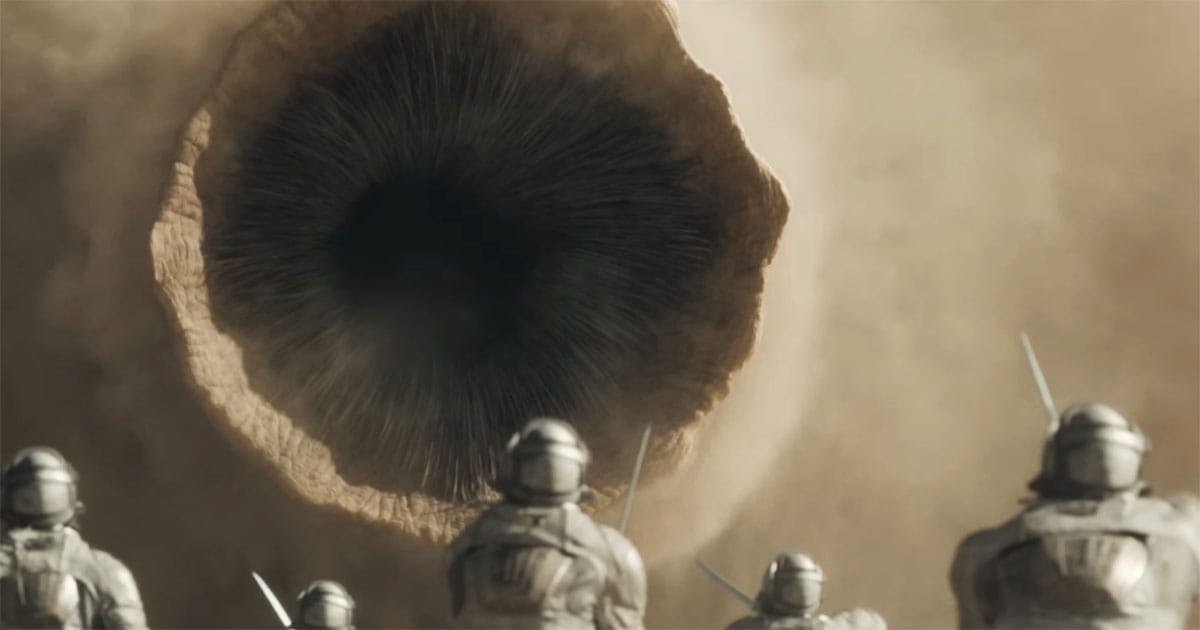 Soldiers facing a giant sandworm on Arrakis, showing the danger of Shai-Hulud in Dune.