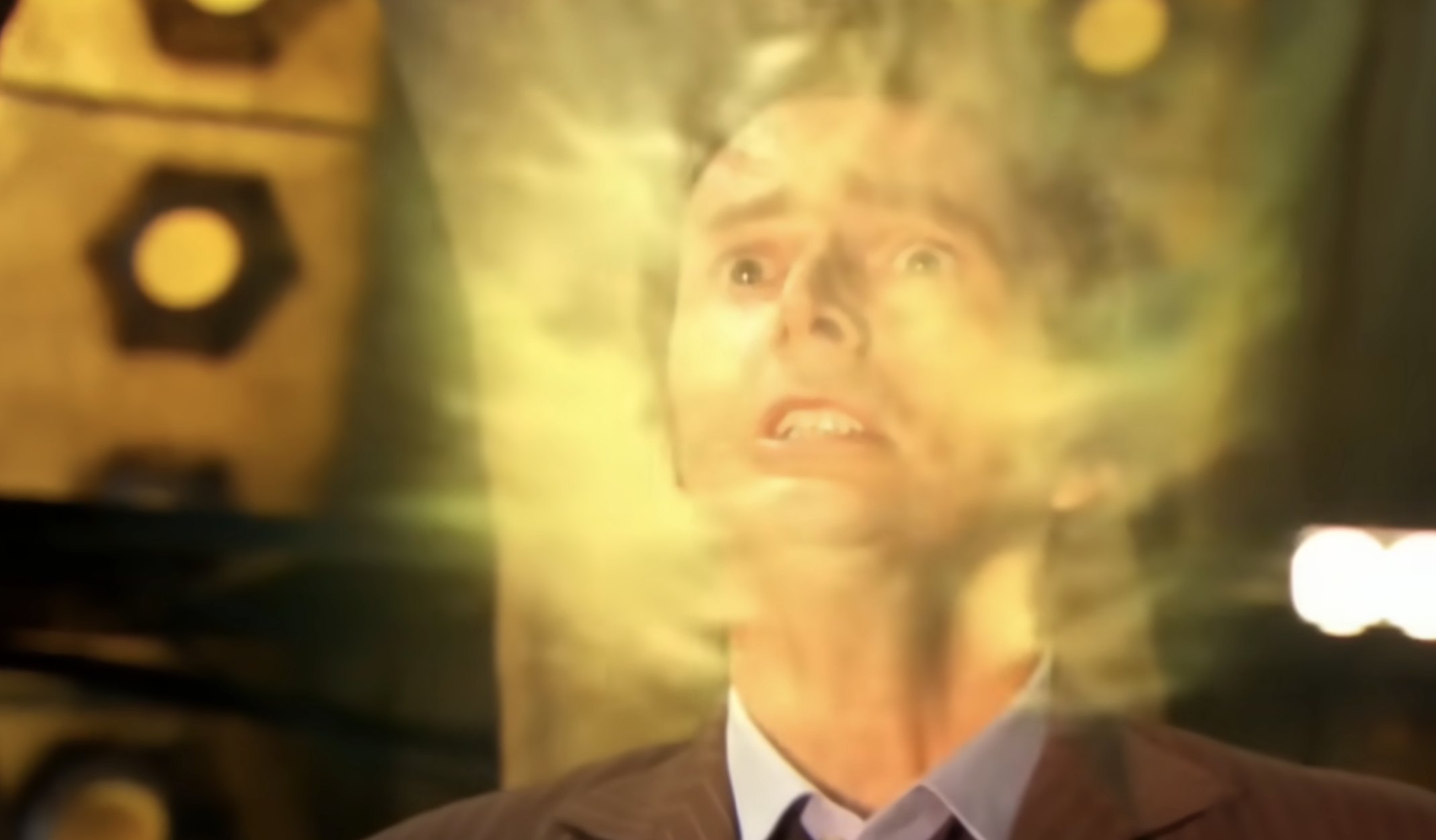 Doctor regenerating with glowing energy showing Time Lord regeneration in Doctor Who.