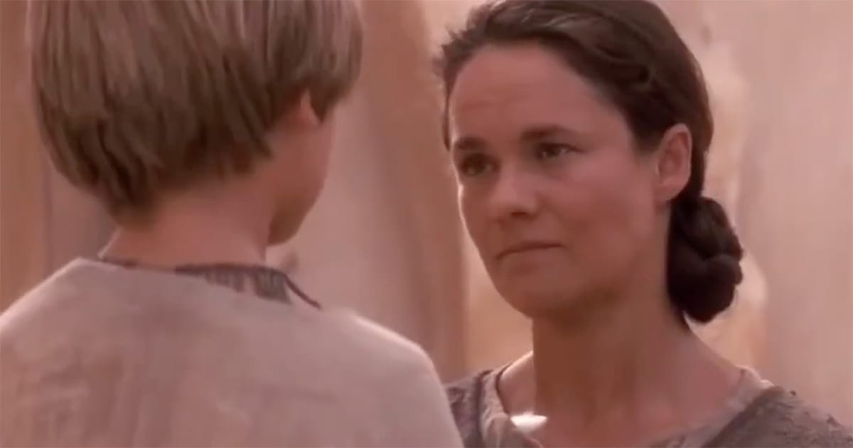 Young Anakin Skywalker speaking with his mother Shmi Skywalker on Tatooine in “The Phantom Menace.”